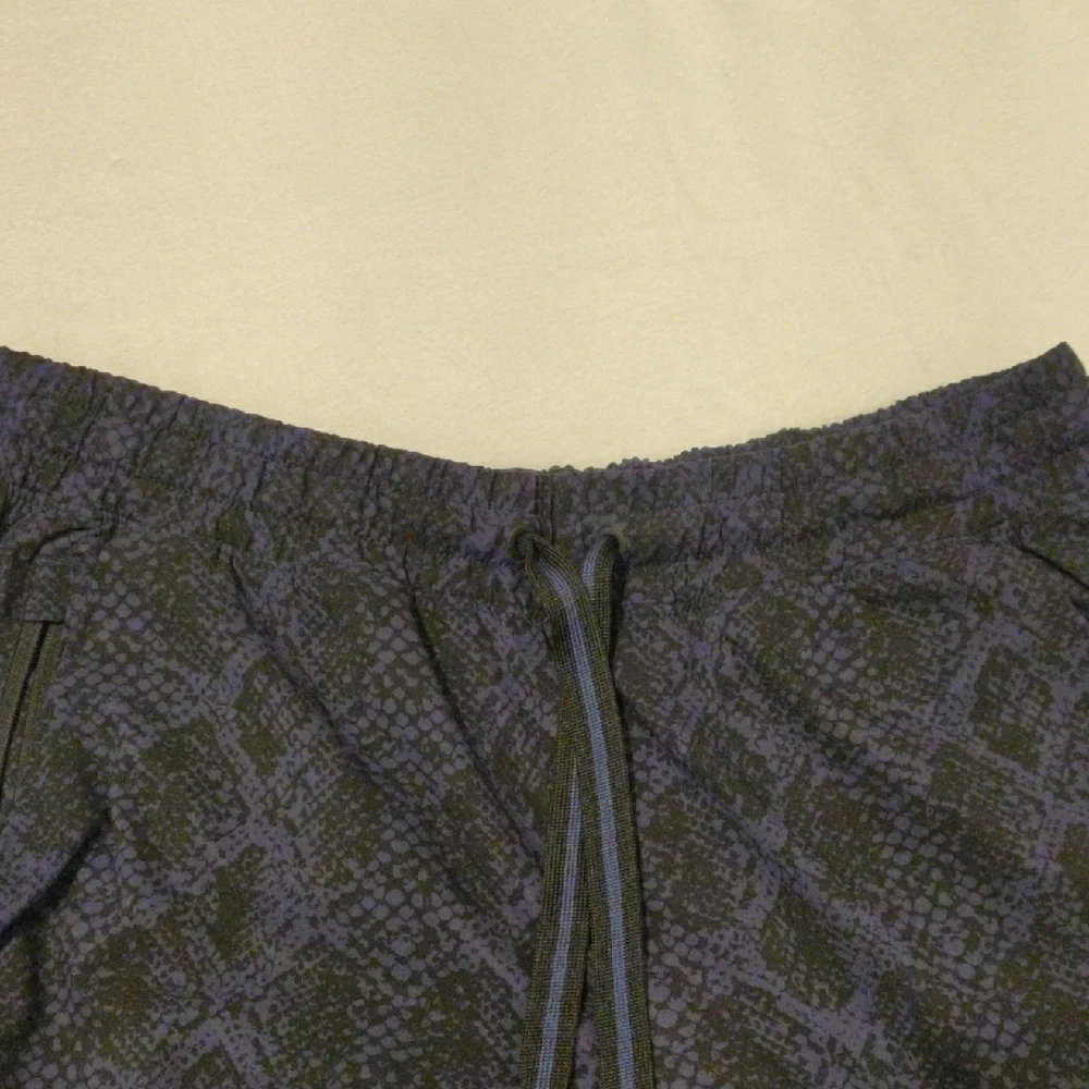 ATHLETA. Men's Black and Blue Patterned Pants